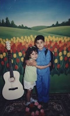 The bride and groom as children hugging